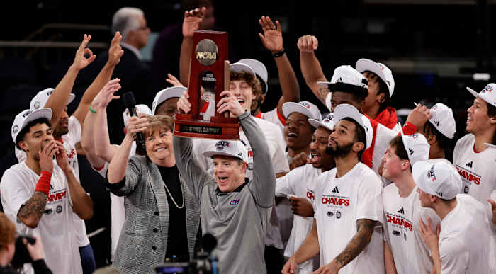 Florida Atlantic head coach Dusty May holds up the East Regional championship trophy after defeating Kansas State in the Elite 8